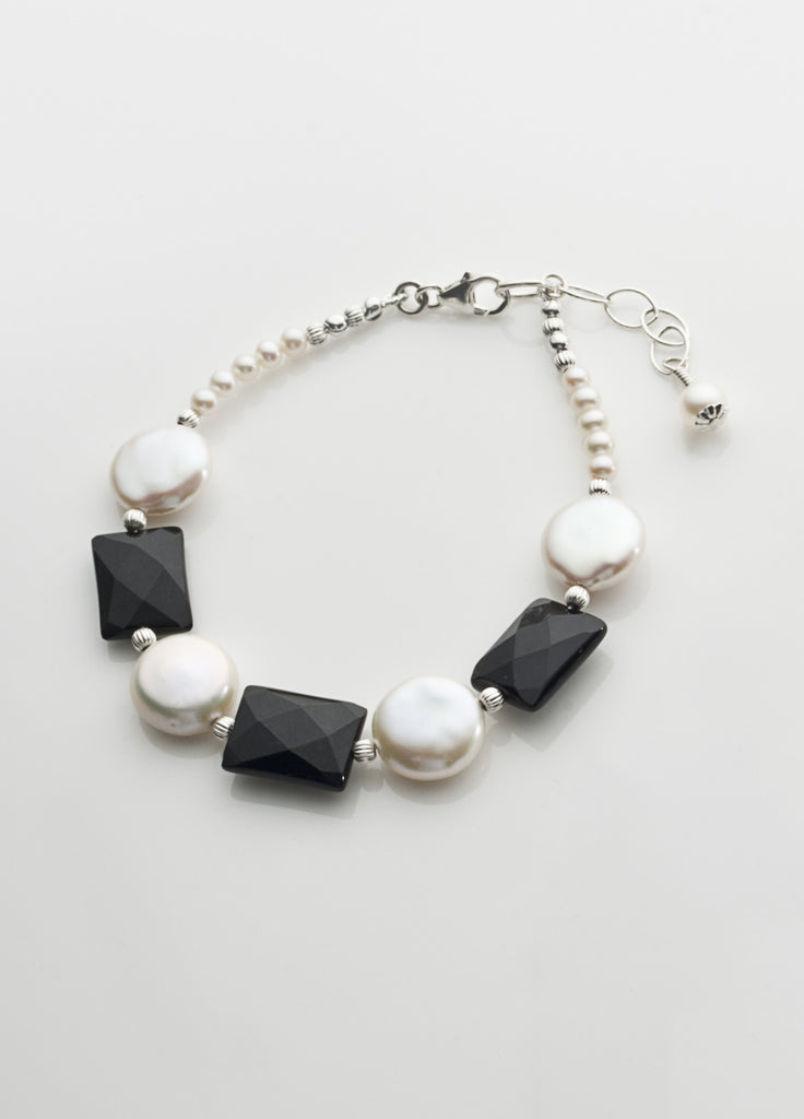 Freshwater pearl coin and faceted black onyx bracelet with sterling silver
